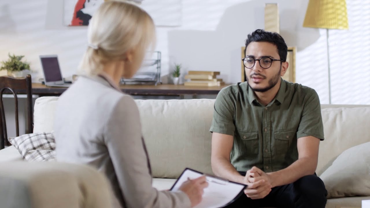 Young man consulting a therapist